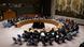 Delegates sit around the horseshoe-shaped table at the UN Delegates sit around the horseshoe-shaped table at the UN