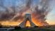 The Freedom Tower in Tehran shrouded in smoke clouds following air strikes The Freedom Tower in Tehran shrouded in smoke clouds following air strikes