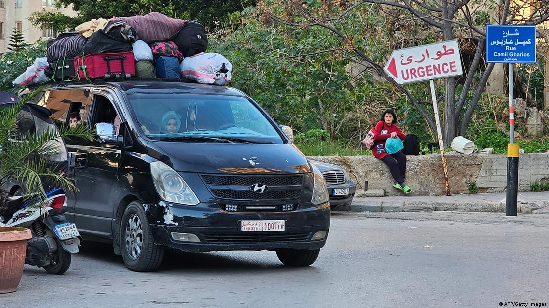 People drive away from Beirut's southern suburbs after the latest issued Israeli warning to the residents to evacuate on March 5, 2026