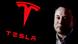 Elon Musk close-up and a Tesla logo. Elon Musk close-up and a Tesla logo.