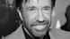 A black and white photo of Chuck Norris A black and white photo of Chuck Norris