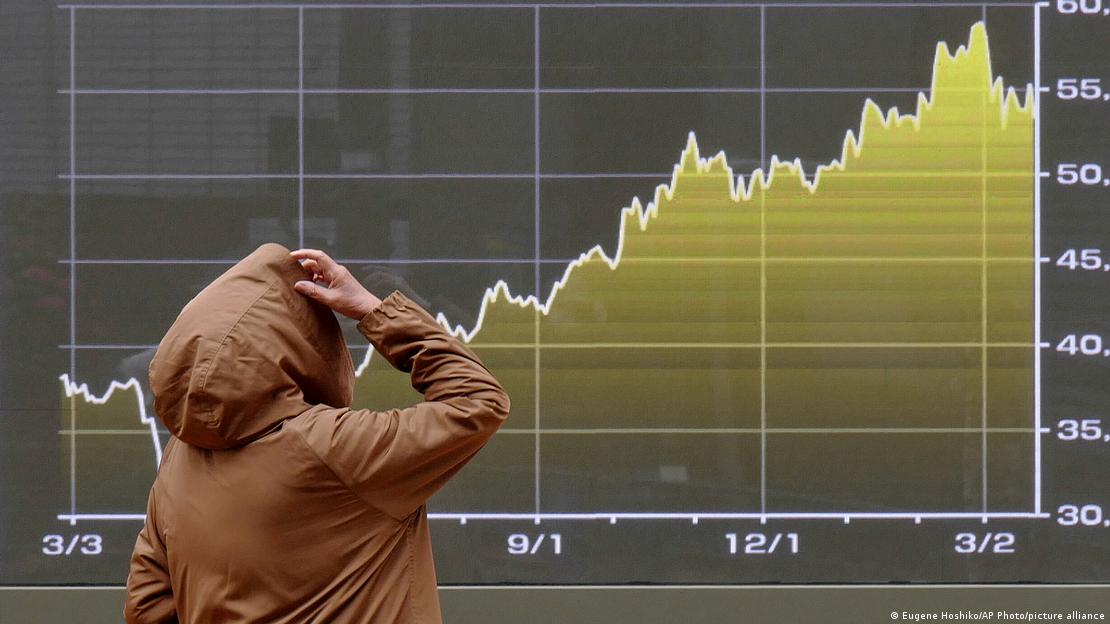  A person looks at an electronic stock board showing Japan's Nikkei index chart at a securities firm Monday, March 23, 2026, in Tokyo.