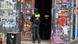 Two police officers enter a building in Berlin covered in graffiti and posters Two police officers enter a building in Berlin covered in graffiti and posters