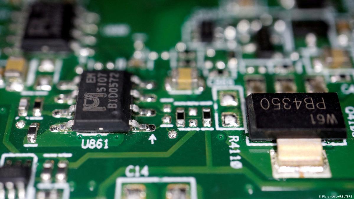 Semiconductor chips are seen on a printed circuit board in this illustration