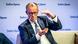 Friedrich Merz na podiju sjedi i govori Friedrich Merz na podiju sjedi i govori