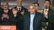 A man (Viktor Orban) looks serious as he holds up both hands. To his right is a lectern with the name of his party, Fidesz. Behind him are several people, who are clapping. Budapest, Hungary, April 12, 2026 A man (Viktor Orban) looks serious as he holds up both hands. To his right is a lectern with the name of his party, Fidesz. Behind him are several people, who are clapping. Budapest, Hungary, April 12, 2026