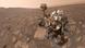 Curiosity Mars rover on Mars, a reddish, rocky landscape Curiosity Mars rover on Mars, a reddish, rocky landscape