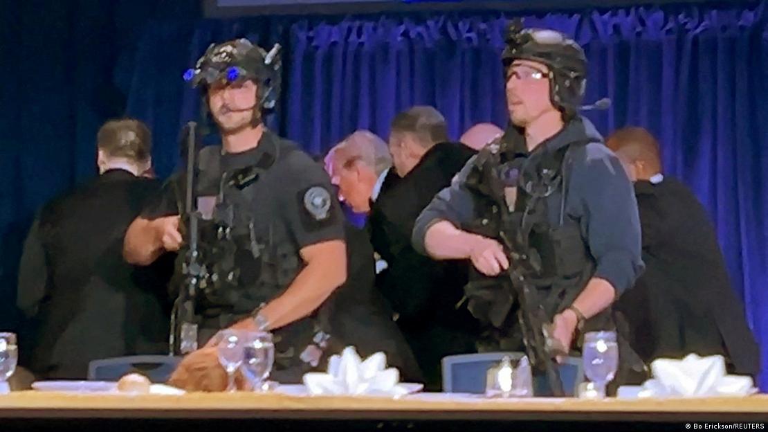 Trump é escoltado por agentes de segurança após tiroteio
