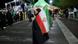 A woman holds an Iranian flag at a regime support rally in Tehran on April 27 A woman holds an Iranian flag at a regime support rally in Tehran on April 27