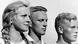 Black-and-white photograph of a young woman and two young men. Black-and-white photograph of a young woman and two young men.