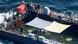 A barge containing a whale with protective sheets stretched above the water-filled enclosure (April 2026) A barge containing a whale with protective sheets stretched above the water-filled enclosure (April 2026)