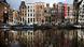Historic canal houses reflected in the water along Amsterdam's Herengracht canal. Historic canal houses reflected in the water along Amsterdam's Herengracht canal.