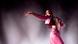 Rosalia in a pink outfit at a concert on stage in 2019 in Bilbao. Rosalia in a pink outfit at a concert on stage in 2019 in Bilbao.