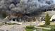 Black smoke and flames billowing from a destroyed building in Zaporizhzhia Black smoke and flames billowing from a destroyed building in Zaporizhzhia
