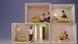 Staged studio scene with several open, cube-shaped living boxes: Multiple people sit or stand inside individual rooms furnished with a sofa, bed, lamp, and plants. The boxes are stacked on top of each other, featuring a light color palette with yellow and beige tones against a neutral background. Staged studio scene with several open, cube-shaped living boxes: Multiple people sit or stand inside individual rooms furnished with a sofa, bed, lamp, and plants. The boxes are stacked on top of each other, featuring a light color palette with yellow and beige tones against a neutral background.