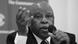 A black-and-white image of Festus Mogae holding a microphone A black-and-white image of Festus Mogae holding a microphone