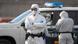 Agentes de la Guardia Civil española con trajes protectores a la llegada del crucero MV Hondius al puerto industrial de Granadilla de Abona, en la isla de Tenerife, España (10.05.2026)