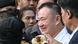 Thailand's former prime minister Thaksin Shinawatra smiles as he greeted by family members on his release at Klong Prem Central Prison in Bangkok on May 11, 2026. Thailand's former prime minister Thaksin Shinawatra smiles as he greeted by family members on his release at Klong Prem Central Prison in Bangkok on May 11, 2026.