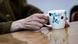Hands of an elderly woman holding a cup on a table (April 2022) Hands of an elderly woman holding a cup on a table (April 2022)