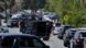  Emergency vehicles and other cars lined up near the mosque