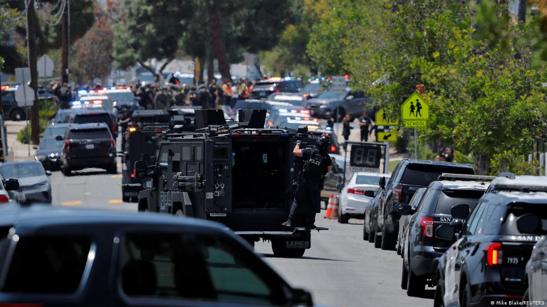 Emergency vehicles and other cars lined up near the mosque