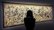 A woman, seen from behind, looks at Jackson Pollock's large canvas, 'Number 7A, 1948' A woman, seen from behind, looks at Jackson Pollock's large canvas, 'Number 7A, 1948'