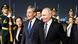 Russian President Vladimir Putin walks with Chinese Foreign Minister Wang Yi and other officials by guard of honor at Beijing airport Russian President Vladimir Putin walks with Chinese Foreign Minister Wang Yi and other officials by guard of honor at Beijing airport