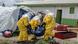 Red Cross workers carry the body of a person who died of Ebola into a coffin at a health center in Rwampara, Congo Red Cross workers carry the body of a person who died of Ebola into a coffin at a health center in Rwampara, Congo