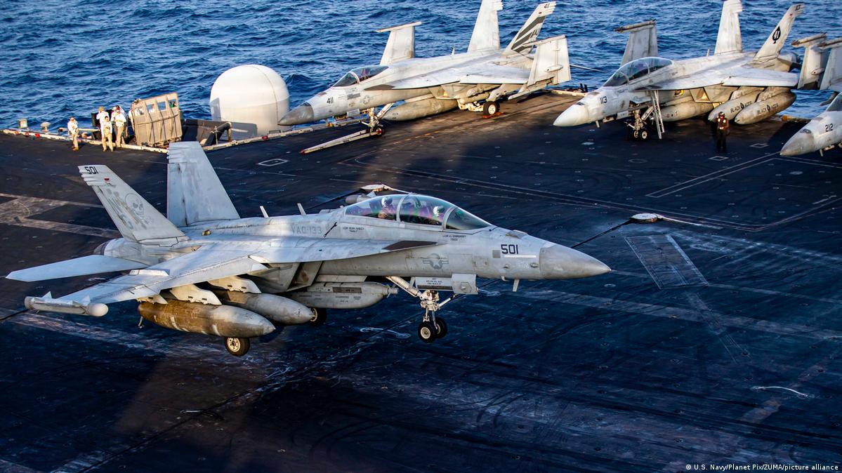 A US Navy warfare aircraft touches down on the flight deck of the Nimitz-class aircraft carrier USS Abraham Lincoln during Operation Epic Fury