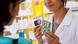A pharmacist holds a blister pack and packet of prozac A pharmacist holds a blister pack and packet of prozac