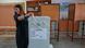 A voter casts a ballot at a polling station during the parliamentary elections in capital Nicosia, Cypru A voter casts a ballot at a polling station during the parliamentary elections in capital Nicosia, Cypru