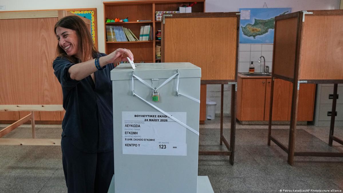 A voter casts a ballot at a polling station during the parliamentary elections in capital Nicosia, Cypru