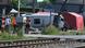 Minibus lying on its side at a level crossing Minibus lying on its side at a level crossing