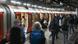 Passengers board London's underground train Passengers board London's underground train