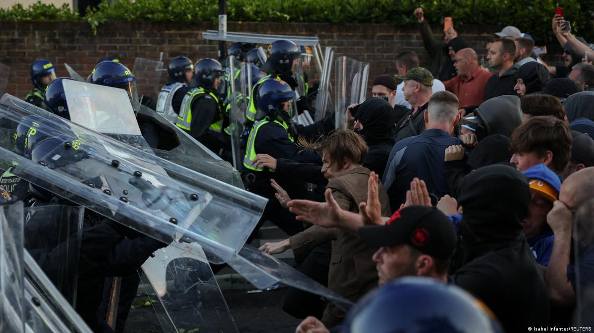 Riot police facing off with protesters