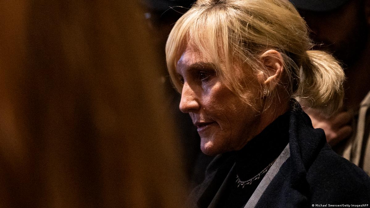 Profile shot of Erin Brockovich, a white woman with blonde hair tied back in a short ponytail, face partly in shadow