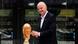 Gianni Infantino walks past the World Cup trophy Gianni Infantino walks past the World Cup trophy
