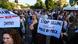 Protesters at a demonstration in front of a government building in Tirana, Albania, June 2, 2026. The placard in the center reads 'Stop selling Albania piece by piece'