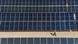 A worker walks past rows of panels at a newly opened industrial-scale solar power plant in Karbala, Iraq, Wednesday, Sept. 17, 2025. Seen from above A worker walks past rows of panels at a newly opened industrial-scale solar power plant in Karbala, Iraq, Wednesday, Sept. 17, 2025. Seen from above