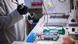 A laboratory technician prepares agarose gels A laboratory technician prepares agarose gels