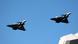 French Air Force Rafale fighter jets fly above the port of Piraeus near Athens, Greece French Air Force Rafale fighter jets fly above the port of Piraeus near Athens, Greece