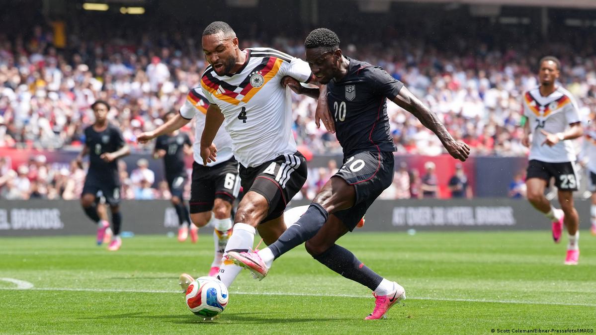 Jonathan Tah wins the ball against USA