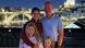 A family of four standing on a balcony overlooking the city of Porto A family of four standing on a balcony overlooking the city of Porto