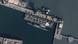Satellite image of Mazagon Dock Shipyard in Mumbai with a submarine anchoring
