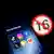 A smartphone displays social media logos with a symbol prohibiting access to those under 16 in the background