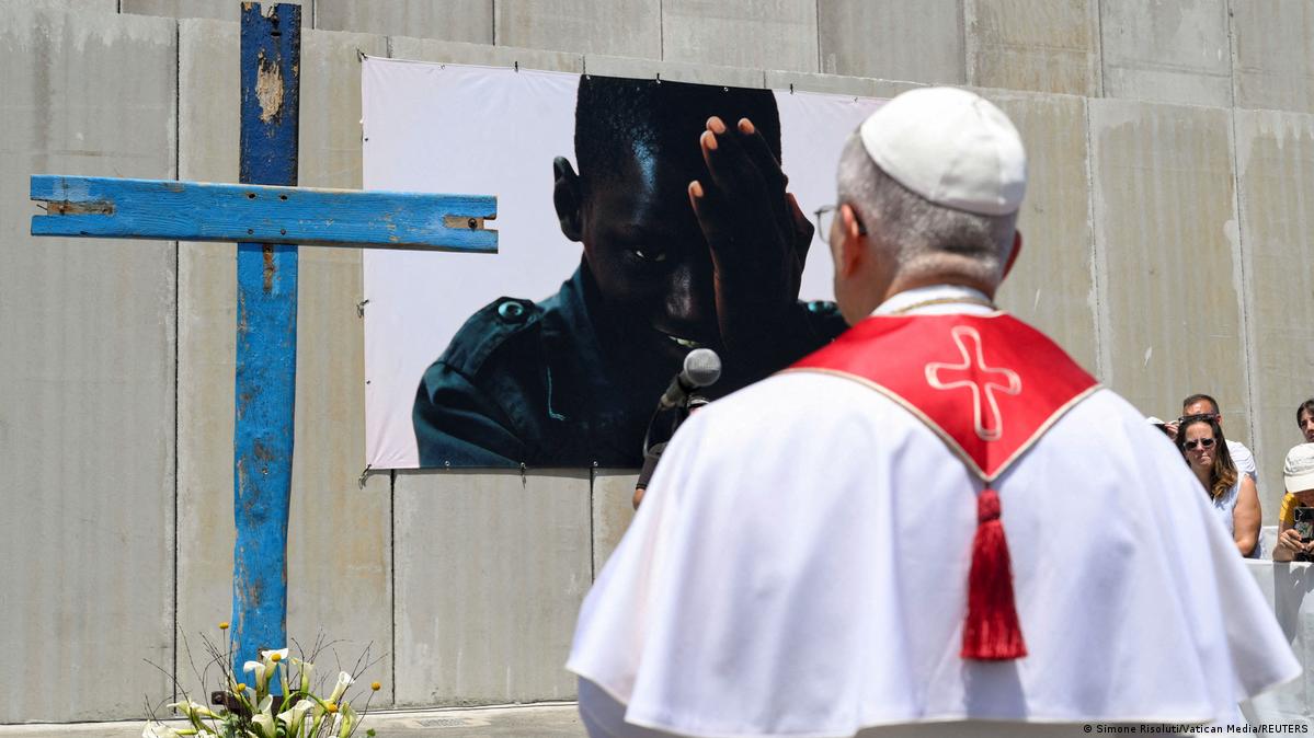 Pope Leo XIV prays to a cross made with wood from migrants' boats, at the dock of the Port of Arguineguin in Gran Canaria, Spain, June 11, 2026