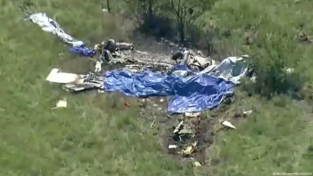 Wreckage lies in a field next to Butler Memorial Airport after a plane crash on June 14
