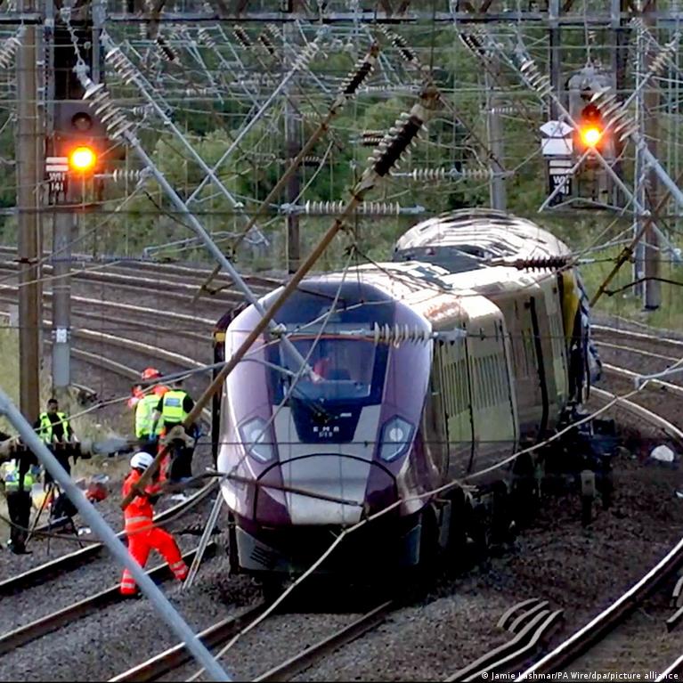 Police vehicles blocking a closed road in Bedford following the rail collision