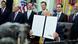 US President Donald Trump holds up a signed executive order regarding quantum computing, in the Oval Office at the White House in Washington, DC, US US President Donald Trump holds up a signed executive order regarding quantum computing, in the Oval Office at the White House in Washington, DC, US