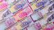 A shot of several Iranian rial notes laid out side by side A shot of several Iranian rial notes laid out side by side